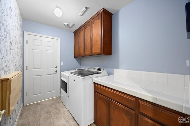 9221 Via Lugano, Bakersfield, CA 93312 - washroom featuring washer and dryer, cabinet space, and wallpapered walls