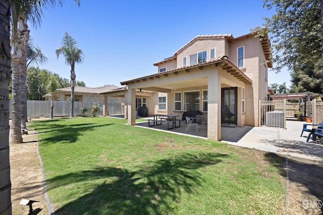 9221 Via Lugano, Bakersfield, CA 93312 - rear view of house with stucco siding, a tile roof, a patio, and central AC unit