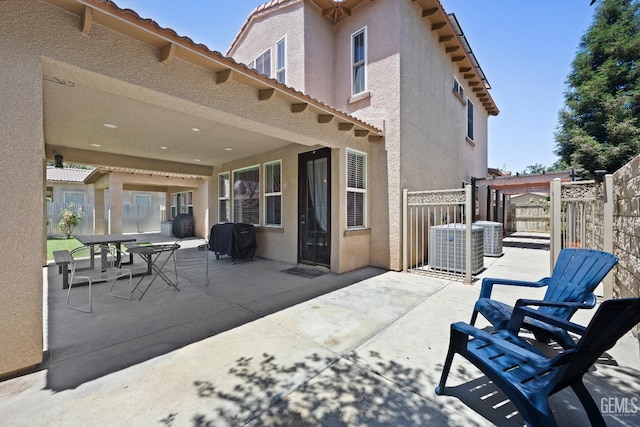 9221 Via Lugano, Bakersfield, CA 93312 - fenced backyard featuring a patio, central AC unit, and a grill