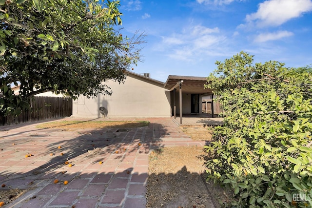 1929 Belmont St, Delano, CA 93215 - rear view of property with stucco siding and a patio area