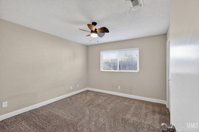1929 Belmont St, Delano, CA 93215 - unfurnished room with ceiling fan, carpet floors, baseboards, and a textured ceiling