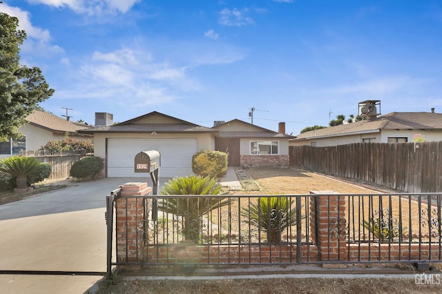 1929 Belmont St, Delano, CA 93215 - ranch-style house featuring concrete driveway, a garage, and stucco siding
