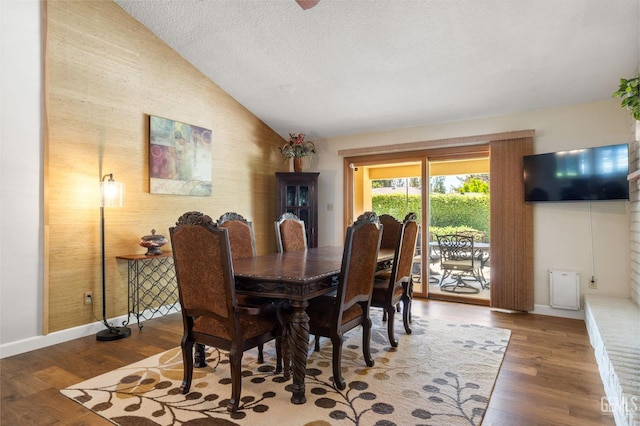 601 Vista Verde Way, Bakersfield, CA 93309 - dining space featuring vaulted ceiling, wood finished floors, and a textured ceiling