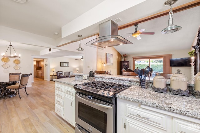 601 Vista Verde Way, Bakersfield, CA 93309 - kitchen featuring ceiling fan, gas range, island range hood, open floor plan, and white cabinets