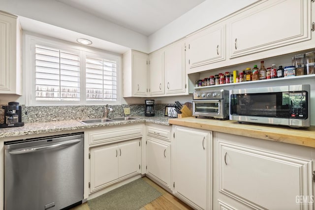 601 Vista Verde Way, Bakersfield, CA 93309 - kitchen with appliances with stainless steel finishes, light wood-style floors, and white cabinets