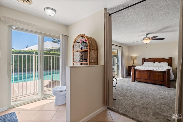 601 Vista Verde Way, Bakersfield, CA 93309 - bedroom featuring access to outside, light tile patterned floors, and light colored carpet