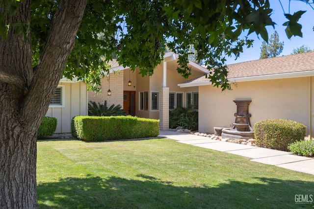 601 Vista Verde Way, Bakersfield, CA 93309 - view of front of house featuring a front lawn, stucco siding, board and batten siding, and roof with shingles