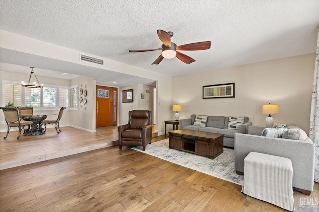 601 Vista Verde Way, Bakersfield, CA 93309 - living area with ceiling fan, a chandelier, wood finished floors, and a textured ceiling