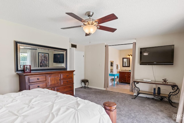 601 Vista Verde Way, Bakersfield, CA 93309 - carpeted bedroom featuring ensuite bath, a textured ceiling, and a ceiling fan