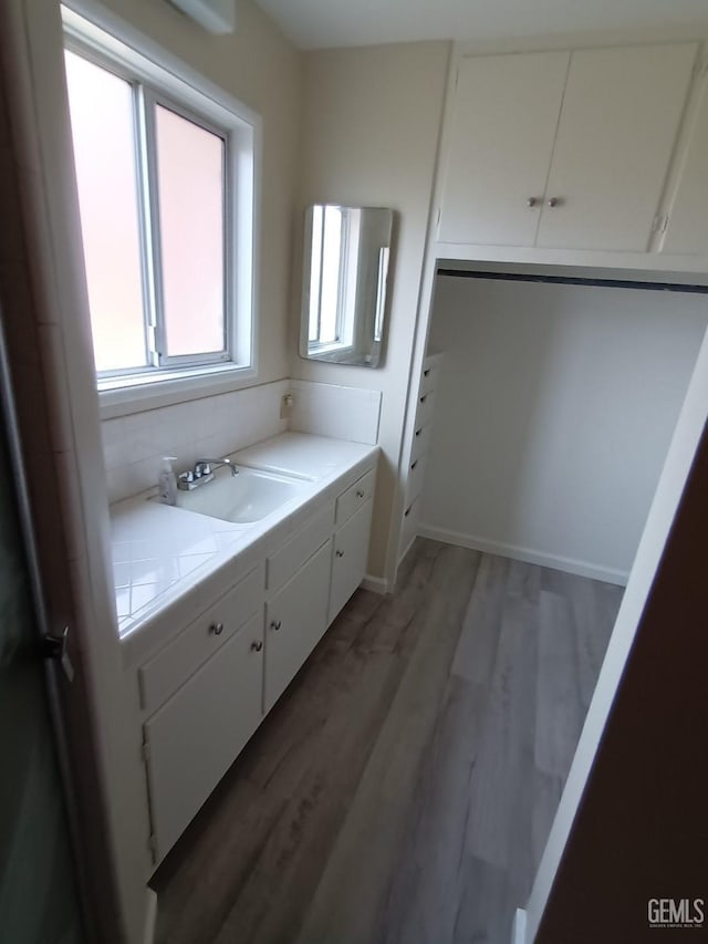 bathroom featuring vanity and hardwood / wood-style flooring