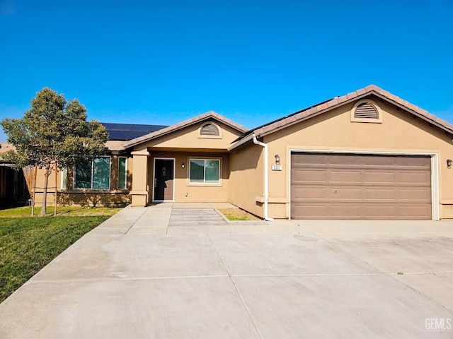 ranch-style house featuring solar panels