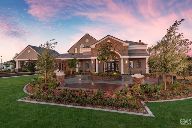 view of front of property featuring a front yard and a chimney