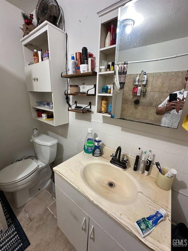 bathroom with decorative backsplash, tile patterned floors, vanity, and toilet