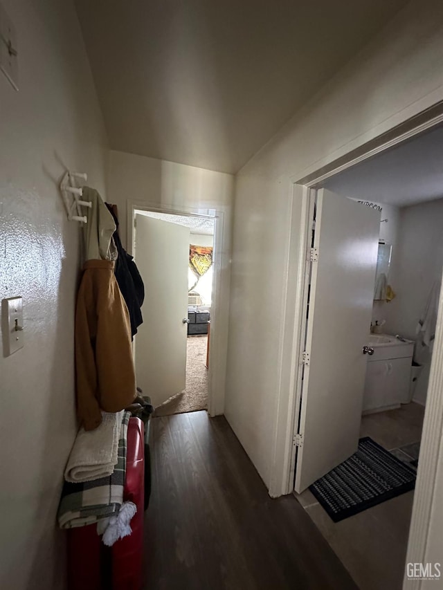 corridor with wood-type flooring