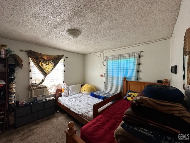 bedroom featuring carpet and a textured ceiling