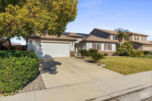 view of front facade with a garage and a front lawn