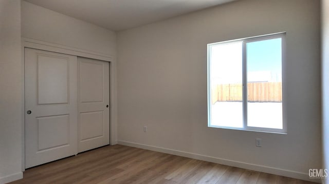 16903 Mairs Dr, Bakersfield, CA 93314 - unfurnished bedroom with light wood-style flooring, multiple windows, and a closet