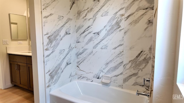 16903 Mairs Dr, Bakersfield, CA 93314 - bathroom featuring vanity, wood finished floors, and bathtub / shower combination