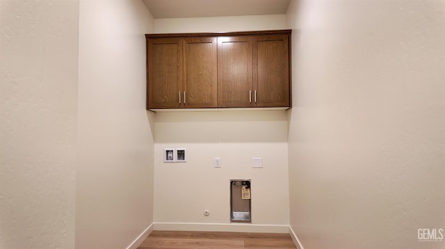 16903 Mairs Dr, Bakersfield, CA 93314 - washroom featuring cabinet space, light wood-type flooring, washer hookup, hookup for a gas dryer, and electric dryer hookup