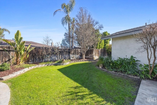 view of yard with a fenced backyard