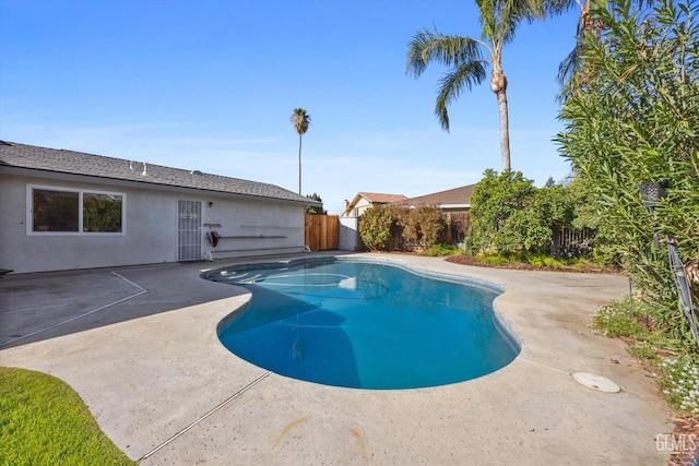 view of swimming pool featuring a fenced in pool, a patio area, and a fenced backyard