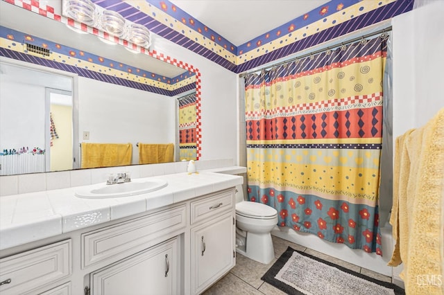 full bathroom with shower / tub combo, vanity, toilet, and tile patterned floors