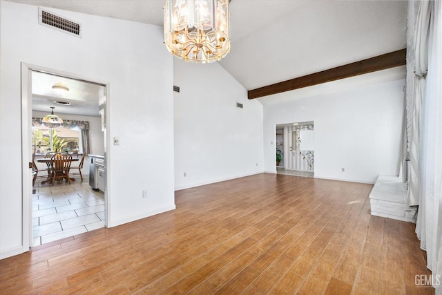 unfurnished living room with visible vents, light wood-style floors, a chandelier, beamed ceiling, and baseboards