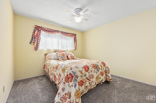 bedroom featuring a ceiling fan, carpet flooring, and a textured ceiling