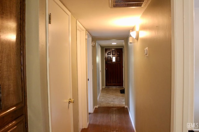 6813 Melones Ct, Bakersfield, CA 93309 - hall featuring baseboards, visible vents, and dark wood finished floors