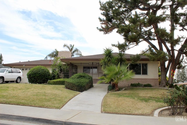 6813 Melones Ct, Bakersfield, CA 93309 - ranch-style house with a front lawn, brick siding, and a garage