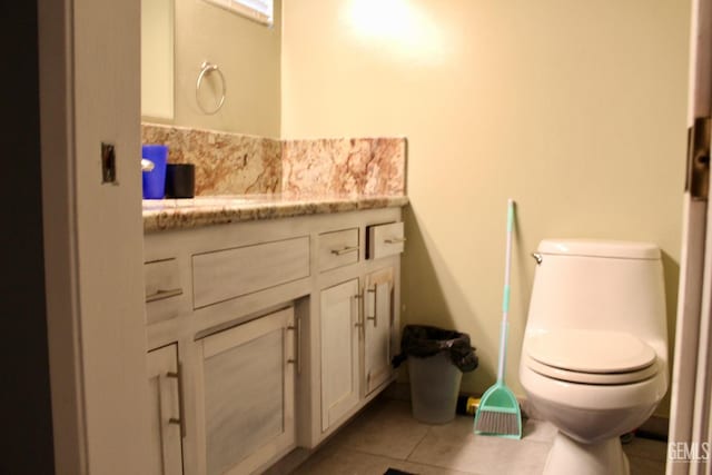 6813 Melones Ct, Bakersfield, CA 93309 - bathroom with tile patterned floors, vanity, and toilet