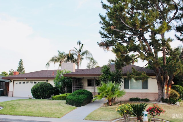 6813 Melones Ct, Bakersfield, CA 93309 - single story home with concrete driveway, an attached garage, brick siding, and a front yard