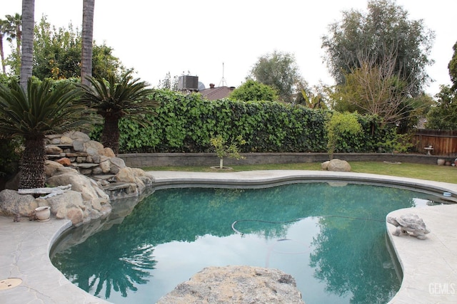 6813 Melones Ct, Bakersfield, CA 93309 - view of pool with central AC unit, fence, and a fenced in pool