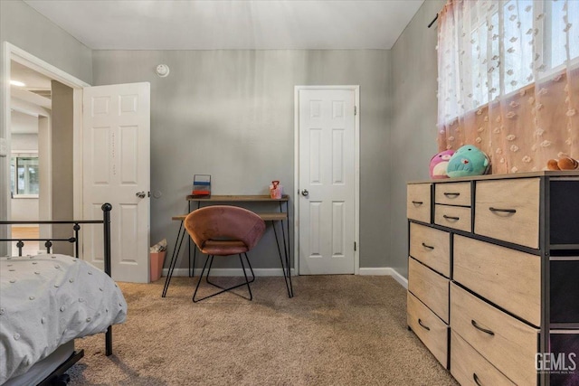 carpeted bedroom featuring multiple windows