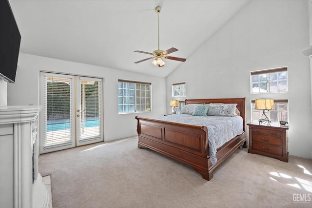 carpeted bedroom with access to outside, ceiling fan, and high vaulted ceiling