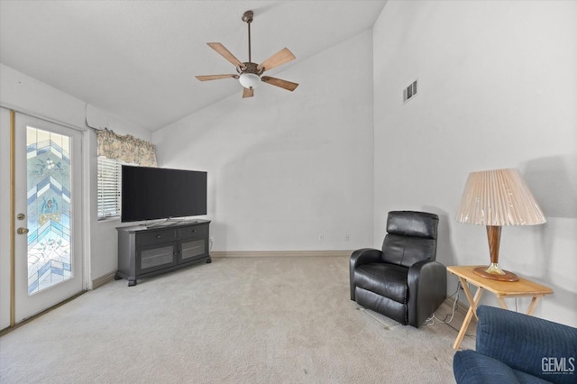 sitting room featuring light colored carpet, high vaulted ceiling, and ceiling fan