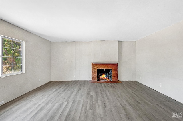 120 Pacific St, Bakersfield, CA 93305 - unfurnished living room featuring wood finished floors and a fireplace