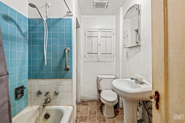 120 Pacific St, Bakersfield, CA 93305 - bathroom featuring washtub / shower combination and tile patterned flooring