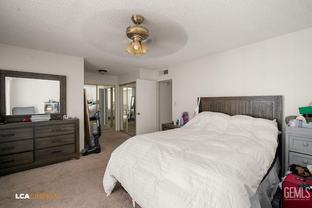 1800 Weyburn Way, Bakersfield, CA 93309 - carpeted bedroom with a closet, a textured ceiling, and ceiling fan