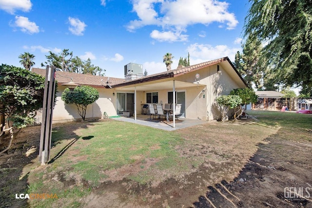 1800 Weyburn Way, Bakersfield, CA 93309 - rear view of house featuring a yard, a patio, and stucco siding