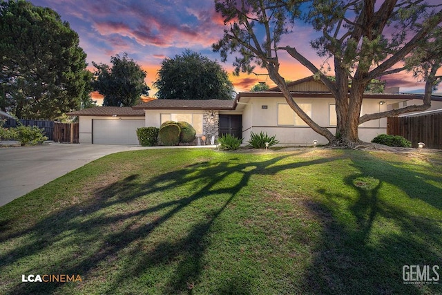 1800 Weyburn Way, Bakersfield, CA 93309 - single story home with concrete driveway, an attached garage, stucco siding, and stone siding
