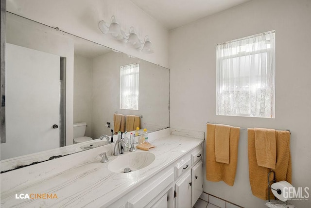 1800 Weyburn Way, Bakersfield, CA 93309 - bathroom featuring toilet and vanity