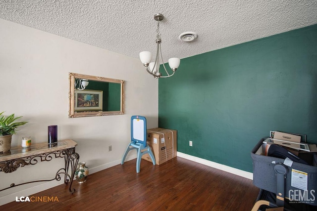 1800 Weyburn Way, Bakersfield, CA 93309 - office area featuring a textured ceiling, a chandelier, and wood finished floors
