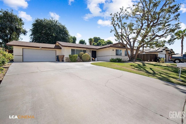 1800 Weyburn Way, Bakersfield, CA 93309 - ranch-style home with stucco siding, an attached garage, a front lawn, concrete driveway, and stone siding