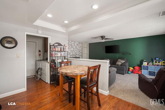1800 Weyburn Way, Bakersfield, CA 93309 - dining room featuring separate washer and dryer, a ceiling fan, wood finished floors, recessed lighting, and a tray ceiling