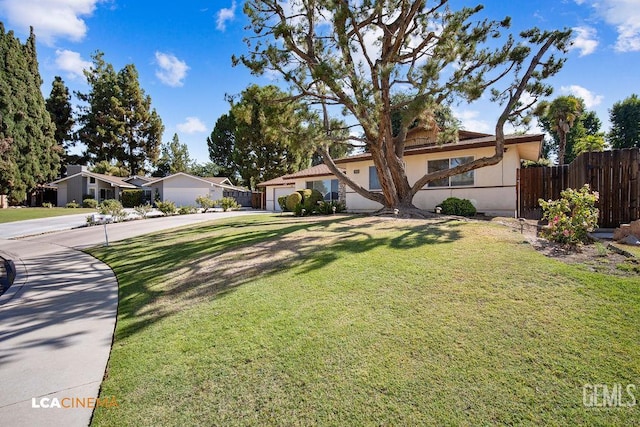 1800 Weyburn Way, Bakersfield, CA 93309 - view of front of property with driveway, an attached garage, and stucco siding