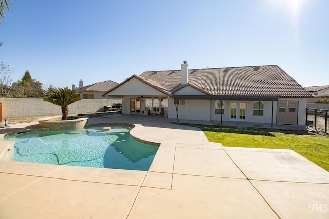 view of swimming pool featuring a patio area and a lawn