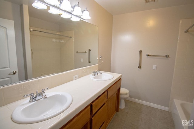 bathroom with decorative backsplash, toilet, vanity, and tile patterned flooring