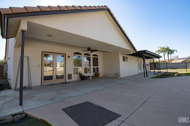 back of house featuring ceiling fan, a patio area, and french doors