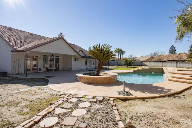 view of pool with ceiling fan and a patio